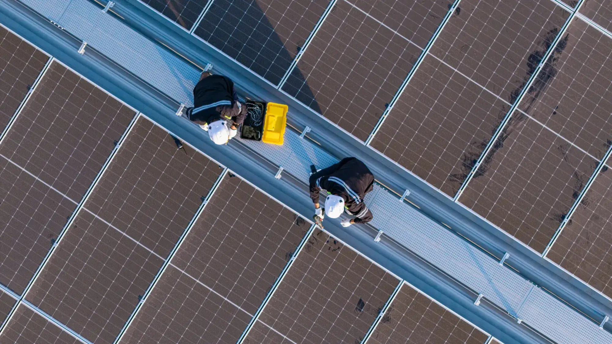 Installers working on a solar roof