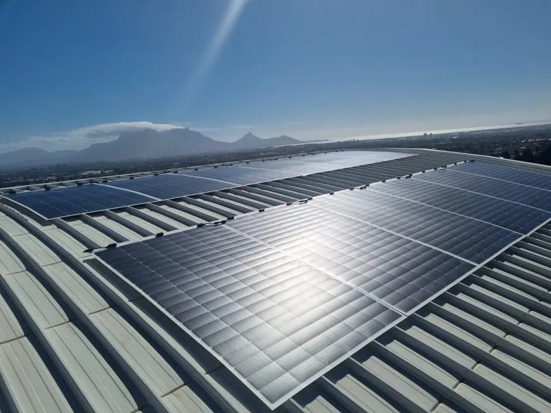 Rooftop solar array on the guesthouse with Table Mountain behind
