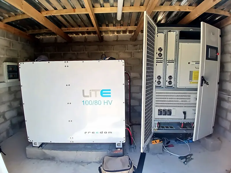 Inverter cabinet open beside the battery at the Stanford site