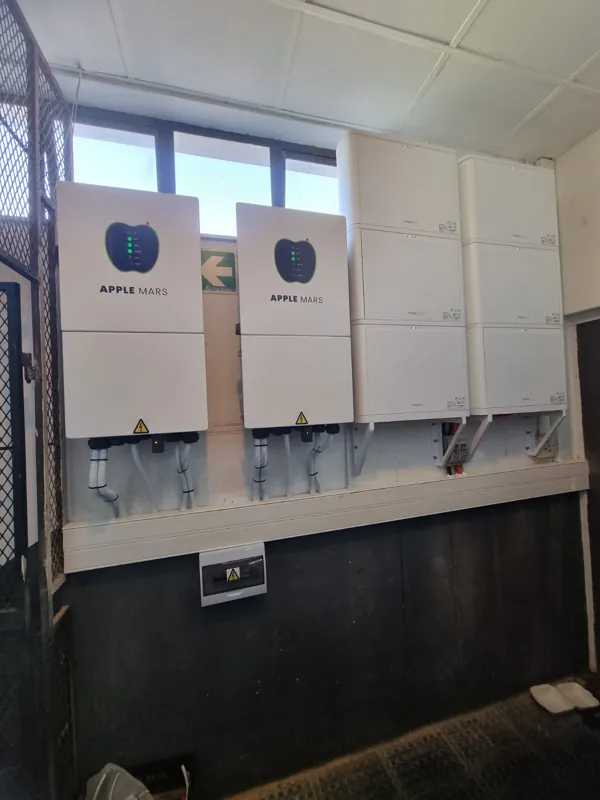 Two Apple Mars inverters and battery modules on the wall